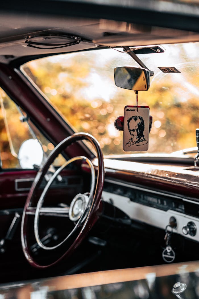Explore a classic car's dashboard and steering wheel, capturing a nostalgic vibe.